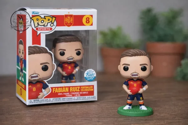 Fabian Ruiz Spain National Football 2026 Celebration Putting the ball under shirt Pop 3D Resin Figure 1 Fabian Ruiz collectible figure on a desk with laptop and coffee mug.